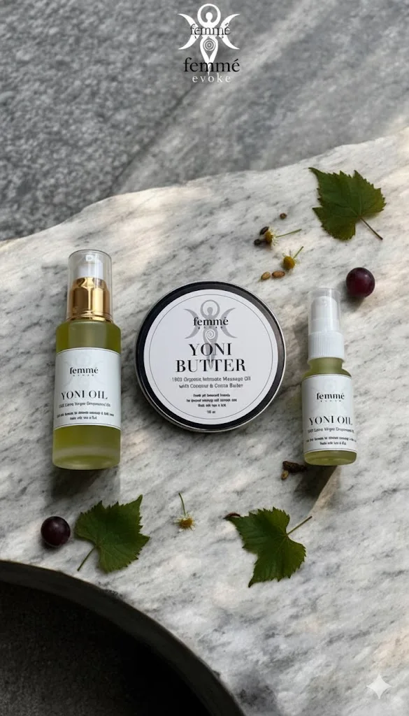 YoniOil oils arranged on marble with botanical ingredients